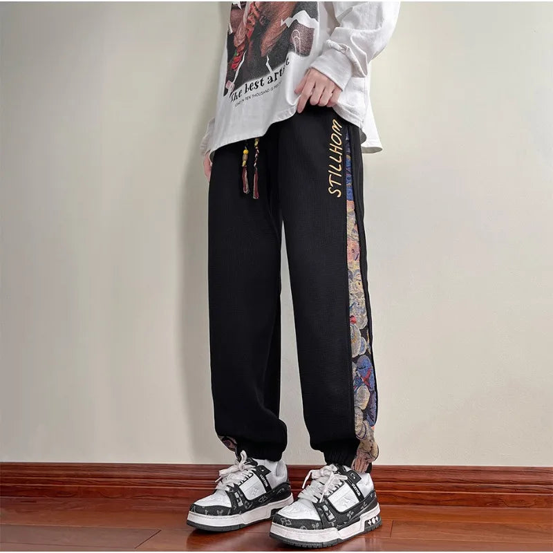 Pantaloni casual con bordo a contrasto con stampa grafica e lacci da uomo - Pantaloni uomo ATREND