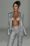 Set coordinato blazer e pantaloni brillantinati da donna
