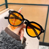 Occhiali da sole rotondi bicolor con lenti trasparenti e colorate unisex - Occhiali da sole unisex ATREND