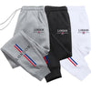Pantaloni sportivi con fascia elastica e lettere da donna ATREND